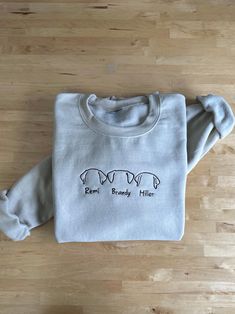 Custom Embroidered Dog sweatshirt Outline Dog Ears Sweatshirt Embroidered Dog Mom Sweatshirt  Dad Sweatshirt for dog lover Custom Dog Tee Handmade PREMIUM HIGH QUALITY 1- Select your " Shirt Size". 2- Select your " Shirt Color". Embroidered Custom Sweatshirt | Personalized Design | Ideal Gift for All Occasions ✨ PRODUCT DETAILS: Material: 50% cotton, 50% polyester Sizing and Colors: Please refer to our product images for detailed information Durability: Features double-stitched seams on the coll Long Sleeve Cotton Sweatshirt With Dog Print, Iron On Sweatshirt Ideas, Embroidered Dog, Dog Ears, Dog Mom Sweatshirt, Dogs Tee, Dog Sweatshirt, Custom Sweatshirts, Embroidered Sweatshirt