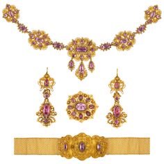 A Georgian pink topaz and gold cannetille suite, the necklace consisting of five graduating from the centre oval-cut pink topaz-set gold links, from the central suspended three pear-shaped topaz-set drops, the links joined together by six oval-cut topaz-set collets with beading decoration, attached to a gold mesh chain with oval-cut topaz-set clasp, the brooch and earrings of similar design, the bracelet consisted of three scalloped-edge plaques each centrally-set with a topaz on a wire-work bac Topaz Yellow, Tiaras Jewellery, Gold Chandelier Earrings, Diamond Tiara, Pink Topaz, Jewellery Shop, Bespoke Jewellery, Antique Earrings, Pink Quartz