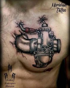 a chest with a tattoo on it that looks like an engine and the words, mechanical tattoo