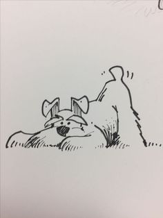 a black and white drawing of a dog laying on the ground next to another dog