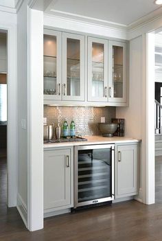 the kitchen is clean and ready to be used as a bar or wine cellar for entertaining