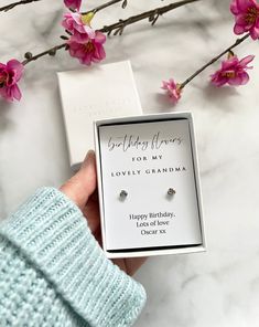 These gorgeous sterling silver flower stud earrings make such a lovely gift for Grandma's Birthday.   The earrings are 925 sterling silver, small, minimal and elegant and perfect as everyday jewellery.  They come with a butterfly back.  They come in a high quality gift box and are mounted on a card which reads 'Birthday flowers for my lovely Grandma'.  To make the gift even more special and meaningful they come personalised with your name at the bottom.    The earrings measure 4mm.  The gift arr Sterling Silver Flower Earrings For Anniversary And Mother's Day, Dainty Earrings For Anniversary And Mother's Day, Dainty Flower Earrings For Anniversary And Mother's Day, Dainty Earrings For Anniversary On Mother's Day, Dainty Flower Earrings For Mother's Day Anniversary, Dainty Earrings For Mother's Day, Silver Flower Earrings For Mother's Day Anniversary, Personalized Silver Earrings For Birthday Gift, Silver Earrings With Birthstone For Gift