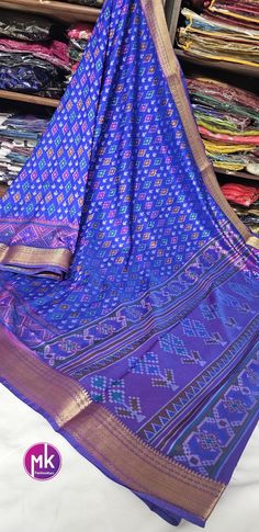 Semi Ikkath Silk Saree ikkath & pochampalli print - Rich pallu weaving border -  Saree with running blouse  Fabric  Saree : Semi Ikkath Silk Saree  Blouse: Running blouse Color     : Saree - Blue with Purple and Gold Jari weaving                  Blouse - Purple Washing instructions : Dry wash only. Note :  10% Colors may vary slightly due to lighting. If you are interested in purchasing this item and have any questions about this item, please feel free to send us a message. SHIPPING : Ready to ship in 1 business day. This item will be shipped from The United States. Bollywood Ikat Print Blouse Piece For Festivals, Traditional Multicolor Ikat Print Sets, Traditional Drape Blouse Piece With Ikat Print For Festivals, Ikat Print Sets For Navratri Puja, Navratri Ikat Print Sets For Puja, Ikat Print Sets For Puja And Navratri, Bollywood Style Festive Ikat Print Traditional Wear, Bollywood Style Festive Traditional Wear With Ikat Print, Festive Bollywood Traditional Wear With Ikat Print