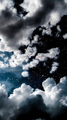 the sky is filled with clouds and stars