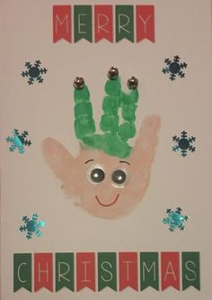 a handprinted christmas card with the words merry and an image of a person's hand