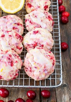 cranberry lemon cookies on a cooling rack with cherries