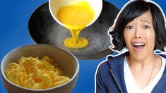 a woman is making scrambled eggs in a bowl and then pouring them into a pan