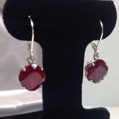 Beautiful Ruby & Sterling Silver Leverback Earrings * Cushion Cut Ruby measure 10mm x 10mm each * 10cts total Gemstone weight * Leverback Fasteners * Solid Sterling Silver * Earrings Measure 1 & 1/8 inches Long overall Hallmarked & Gift Ready! Matching Pendant can be found here https://www.etsy.com/listing/508867924/beautiful-5ct-cushion-cut-ruby-pendant Matching Ring can be found here https://www.etsy.com/listing/487853835/beautiful-5ct-cushion-cut-ruby-sterling Matching Bracelet al Gems Bracelet, Ruby Pendant, Ruby Earrings, Leverback Earrings, Colourful Necklace, Yellow Gold Earring, Large Earrings, Matching Bracelets, Earrings Sterling Silver