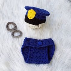 a crocheted hat, diaper cover and pair of scissors