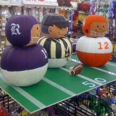 three inflatable footballs sitting on top of a table