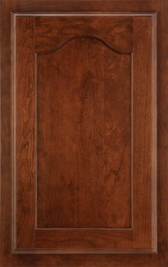 a wooden cabinet door with an ornate design on the front and side panel, in dark brown