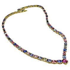 The stunning one-of-a-kind multicolor sapphire necklace features yellow, peach, green, pink, and blue oval cut Burmese natural sapphires Ranging from medium-light to saturated in hue while weighing in a total of 50.00 carats, 18 karats yellow gold. Natural unheated - Untreated Burma blue, pink, yellow sapphires. 18"L. Box clasp. Total Necklace Weight: 36.7 grams Condition: New 100% NATURAL Guaranteed ~ One of a Kind~ Sapphire Diamond Necklace, Diamond Necklace Wedding, Gold Drop Necklace, Silver Link Necklace, Rainbow Sapphires, Gold Link Chain, Solitaire Pendant Necklace, Emerald Bead, Purple Sapphire