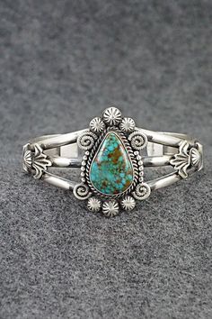 This stunning Kingman turquoise and sterling silver bracelet was made by Navajo silversmith Rosita Calladitto. The back is signed R Calladitto and stamped Sterling.Size: 5 5/8" (will fit up to a 6 3/4" wrist)Gap: 1 1/8"Width: 1 5/8"Cuff Width: 1/2"Free shipping on all orders! We ship with USPS and always include tracking. All orders ship within a day of payment.Returns are accepted up to 30 days after you receive your order. Just send us a message. Our shop offers cash back or store credit. The Kingman Turquoise, Sterling Silver Bracelet, Cuff Bangles, Native American Jewelry, Turquoise Sterling Silver, Free Jewelry, Sterling Silver Bracelets, Silver Gold, Silver Bracelet