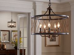 a chandelier hanging from the ceiling in a living room