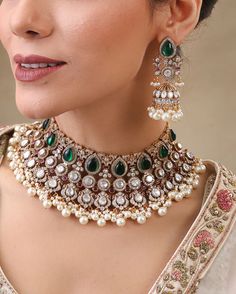 Gorgeous Sabyasachi inspired Kundan Necklace with matching Jhumka  earrings. Green stones are made of natural onyx and white tiny ones of high quality cubic zirconia AAA Grade culver foiled Moissanite Kundan stones are used . Metal: Pure silver mix brass. Silver content around 20%. 22K gold and rhodium plated. This choker is flexible and takes the shape of the neck. Fine quality and craftsmanship. Perfect for desi weddings. Necklace comes in drawstring cord therefore adjustable Please let me kno Emerald Necklace Indian, Indian Bridal Jewellery, Sabyasachi Jewellery, New Gold Jewellery Designs, Necklace Emerald, Jewellery Indian, Polki Necklace, Necklace Indian, Indian Necklace