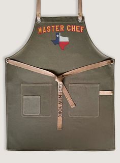 a chef's apron with the texas flag on it and words that read master chef