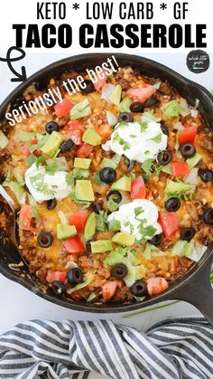 a skillet filled with taco casserole and topped with avocado