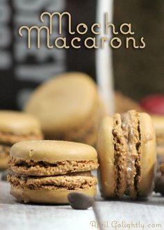 some cookies are stacked on top of each other with the words mocha macarons above them