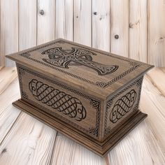 a wooden box sitting on top of a wooden floor