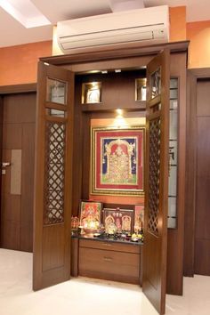 an open wooden door with pictures on it