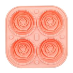 an orange plastic tray with four flower shapes