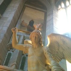 an angel statue in the middle of a building