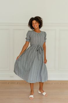 If you're a fan of classic gingham, the 'Selma' midi dress is for you! Featuring a stunning A-line silhouette and soft smocked sleeves, this cotton midi dress is perfect for the fall season. Pair with low ankle boots for the sweetest fall photoshoot ensemble! Self & Lining 100% Cotton Machine Cold Gentle Cycle Do Not Bleach Cool Iron If Needed Hang to Dry Fully Lined Model Height 5'9" | Wearing Size Small Please carefully measure a similar item before placing your order to allow for the best fit Gingham Dress Fall, Smocked Sleeve, Low Ankle Boots, Fall Photoshoot, Cotton Midi Dress, Layered Tops, Gingham Dress, Skirt Leggings, Blouse Dress