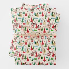 christmas wrapping paper with santa claus and trees on it