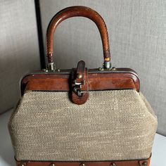 Vintage Etienne Aigner Hand Made Doctor Bag Satchel Purse Mid Century Amazing. Handles Show Signs Of Wear But For A Mid Century Item Its In Good Condition. Woven Linen Exterior With Brown Leather And Metal Details. Elegant Travel Satchel With Brass Hardware, Elegant Satchel With Brass Hardware For Daily Use, Classic Beige Bags With Brass Hardware, Vintage Double Handle Satchel For Errands, Beige Bags With Brass Hardware For Daily Use, Elegant Brown Satchel With Brass Hardware, Daily Beige Bags With Brass Hardware, Vintage Shoulder Bag With Leather Handles For Errands, Beige Travel Bag With Brass Hardware