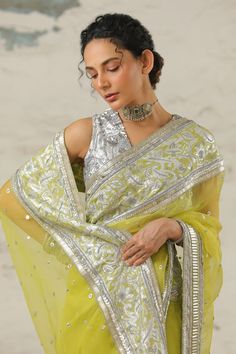 Green saree embellished with intricate hand embroidery, using applique and aari technique in metallic silver. Comes with plain silver unstitched blouse piece. - Aza Fashions Pista Green Chanderi Blouse Piece For Reception, Chanderi Pre-draped Saree With Intricate Embroidery For Reception, Embroidered Pista Green Pre-draped Saree For Reception, Pista Green Chanderi Choli With Intricate Embroidery, Intricate Embroidered Pista Green Chanderi Choli, Pista Green Saree With Intricate Embroidery, Festive Pista Green Blouse Piece With Intricate Embroidery, Festive Blouse Piece With Intricate Embroidery, Festive Tissue Silk Blouse With Intricate Embroidery