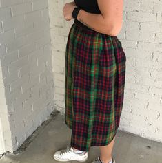 "Adorable high waist skirt is red, blue, yellow, & green plaid print throughout, knee length, metal zip, snap button & hook eye closure on side, fully lined. ( top & shoes not included) Good vintage condition. There is one tiny pin hole that is not noticeable ( see last photo for details) No brand, material or size label Material appears to be wool blend? Fits women's size: XS ( refer to measurements for proper fit) 🌼 Model is 5'4 and measures * 28/33🌼 ( skirt was too small at the Plaid Pencil Skirt For Spring, Plaid Pencil Skirt For Spring Season, Casual Plaid Midi Skirt, Plaid Midi Skirt Casual Style, High Waist Plaid Pleated Skirt, Plaid Cotton Relaxed Skirt, Casual Plaid Pencil Skirt, Plaid Full Skirt With Lining, Plaid Cotton Lined Skirt Bottoms