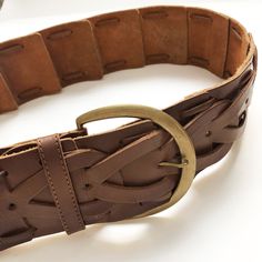 "This is a wide beautifully crafted vintage belt. It features thick brown leather squares with a tear shape pieced together and accented with a large demi circle brass buckle. Excellent vintage condition. MEASUREMENTS: Length: adjustable from 27.5\" (70 cm) to 36\" (91 cm) Width: 2.75\" (7 cm) Buckle: 3.5\" (9 cm) x 3\" (8 cm) * Please note the colour on the pictures may vary due to monitor settings and light reflections. ❤ Thank you for your visit! ❤ For more fabulous vintage finds:  https://ww Brown Leather Belt With Brass Hardware, Brown Bohemian Belt With Brass Buckle, Brown Leather Belt Buckles With Antique Buckle, Brown Leather Belt Buckle With Antique Detail, Brown Leather Belt Buckle With Antique Style, Brown Leather Belt Buckle With Antique Design, Brown Leather Antique Belt Buckle, Adjustable Brown Belt With Brass Buckle, Vintage Adjustable Brown Belt Buckles