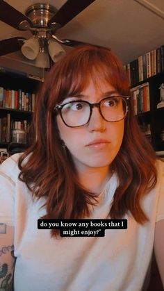 a woman with glasses is looking at the camera and has a caption that reads, do you know any books that i might enjoy?