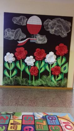 this is an image of a classroom door decorated with flowers and letters on the floor