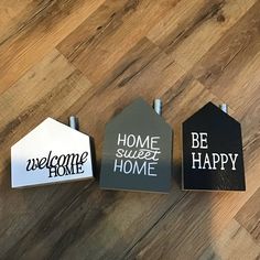 three black and white tags with the words home sweet home, be happy on them