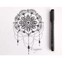 a pen and some ink on paper with a drawing of a flower in the middle