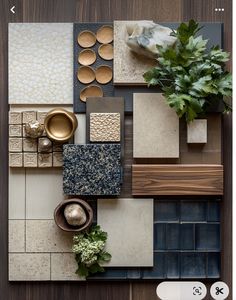 an overhead view of various tiles and accessories on a wooden table with a plant in the middle