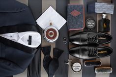 men's grooming items laid out on striped cloth