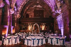 a banquet hall with tables and chairs set up for a formal function at the cathedral