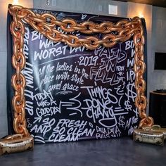 a large blackboard with chains attached to it