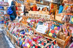 the people are looking at many different items on display in the market place for sale