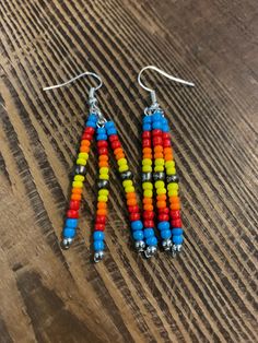 cute punchy western earrings. handmade with glass painted beads.great gift for a western fashion loving queen. Western Sunrise, Painted Beads, Western Earrings, Etsy Earrings Dangle, Earrings Handmade, Western Fashion, Jewelry Earrings Dangle, Dangle Drop Earrings, Dangle Earrings