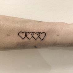 three hearts tattoo on the arm