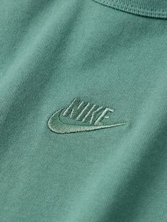 Nike has perfected the basics. This T-shirt is made from breathable cotton-jersey and embroidered at the chest with a signature 'Swoosh'. Pair yours with classic 'Air Max' sneakers. Cotton Athleisure Tops With Branding, Cotton Athleisure Tops, Sports Cotton T-shirt With Embroidered Graphics, Sportswear Tops With Logo For Streetwear, Basic Tops With Embroidered Logo For Streetwear, Green Top With Letter Embroidery For Streetwear, Green Letter Embroidery Top For Streetwear, Sporty Cotton T-shirt With Embroidered Graphics, Basic Crew Neck Tops With Embroidered Logo