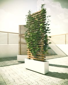 a tall planter sitting on top of a white brick floor next to a wooden fence