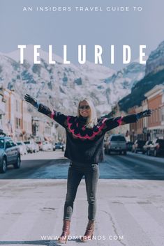 a woman standing in the middle of an empty street with her arms spread out and text overlay that reads, an insider travel guide to telluride