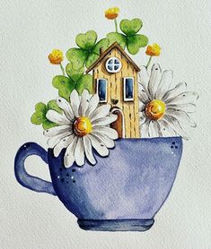 a watercolor drawing of a blue cup with daisies and a house in it