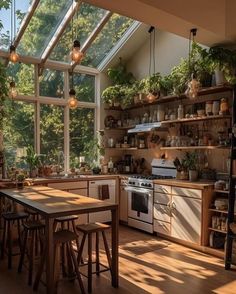 a kitchen filled with lots of counter top space and wooden flooring next to an open window