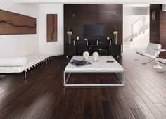 a modern living room with white furniture and wood flooring is featured in this image