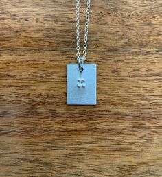 This is a Braille necklace in which you can fit 1-2 letters on. It's 18 inches and the pendant is 3/4 inch. It makes a great gift for friends, family, or yourself, especially with the holidays coming up! Braille Necklace, 2 Letter, Name Necklaces, Name Necklace, For Friends, Dog Tag Necklace, Gifts For Friends, Necklace Lengths, 4 Inch